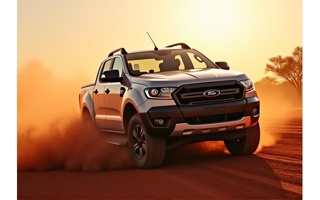 Vehicle covered in red dust driving on an Australian outback road